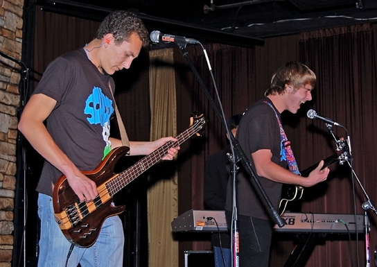 Seniors True Randall and Bill Grundler play bass and guitar, respectively, for the local student band, The Rhine. Credit: Alex Phelps.